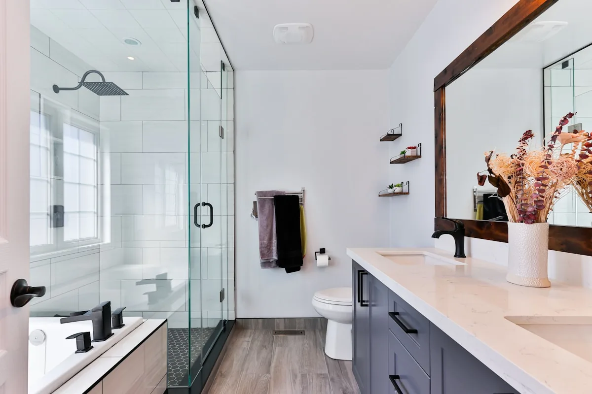 Clean modern bathroom with glass shower and tidy vanity