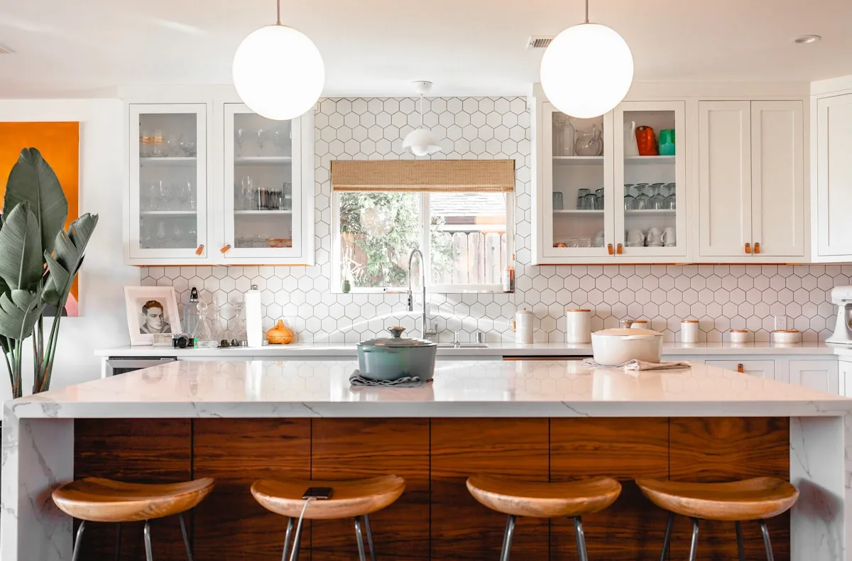 Bright clean residential kitchen with polished counters and organized surfaces
