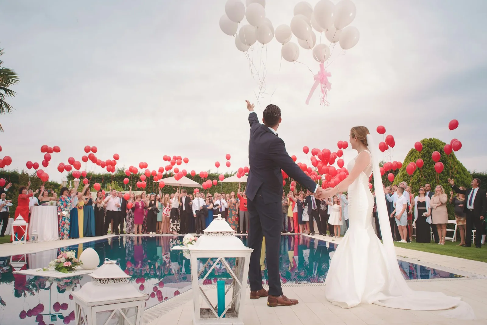 Wedding celebration with a couple and guests outdoors