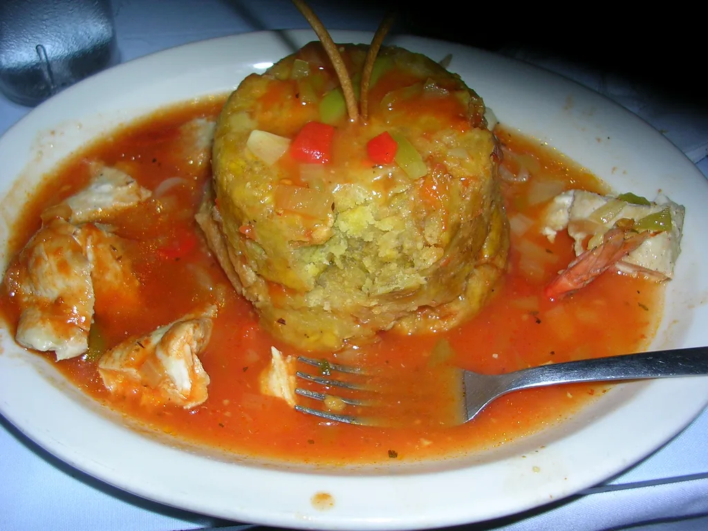 Mofongo made from mashed fried plantain with seafood and pork